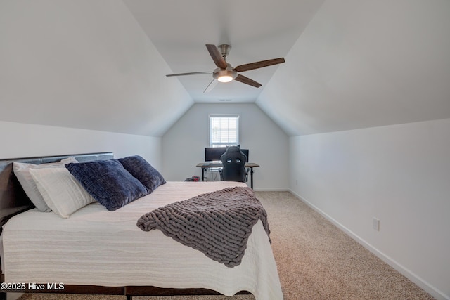 bedroom featuring carpet, vaulted ceiling, baseboards, and ceiling fan