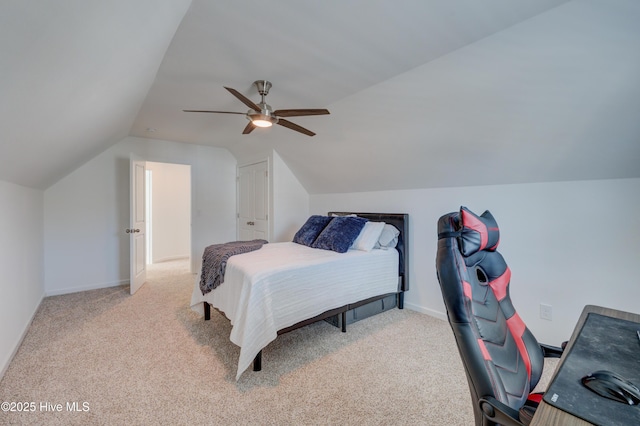 bedroom with ceiling fan, vaulted ceiling, carpet flooring, and baseboards