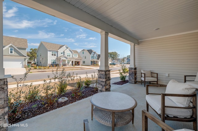 view of patio / terrace with covered porch and a residential view