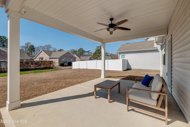 view of patio / terrace with ceiling fan, fence, and an outdoor hangout area