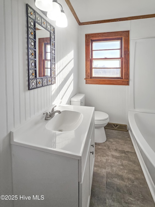 bathroom with toilet and vanity