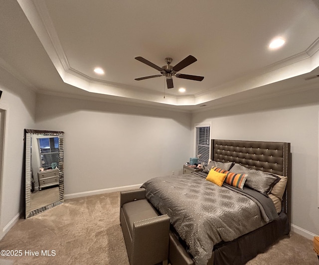 bedroom with carpet floors, recessed lighting, a raised ceiling, and crown molding