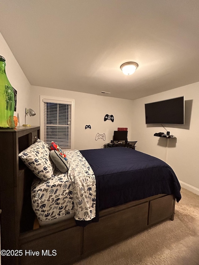 carpeted bedroom with baseboards