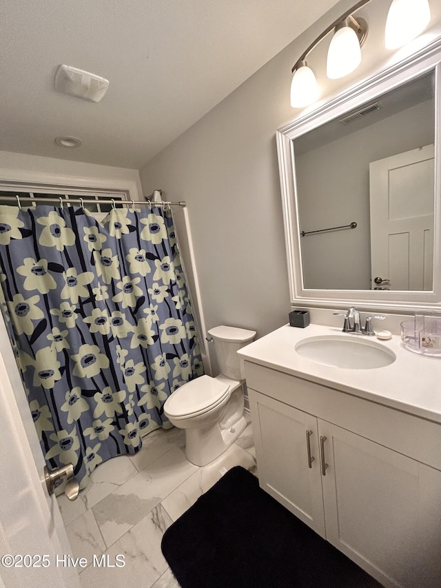 full bath featuring marble finish floor, curtained shower, visible vents, toilet, and vanity