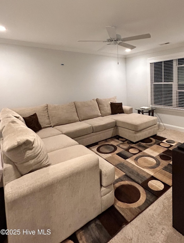 living area with ornamental molding, carpet, a ceiling fan, and recessed lighting