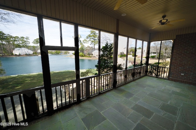155 Abbington Pl SW, Ocean Isle Beach, NC 28469 - unfurnished sunroom featuring ceiling fan, a water view, and healthy amount of natural light