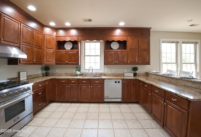 155 Abbington Pl SW, Ocean Isle Beach, NC 28469 - kitchen featuring open shelves, white dishwasher, high end stove, under cabinet range hood, and recessed lighting