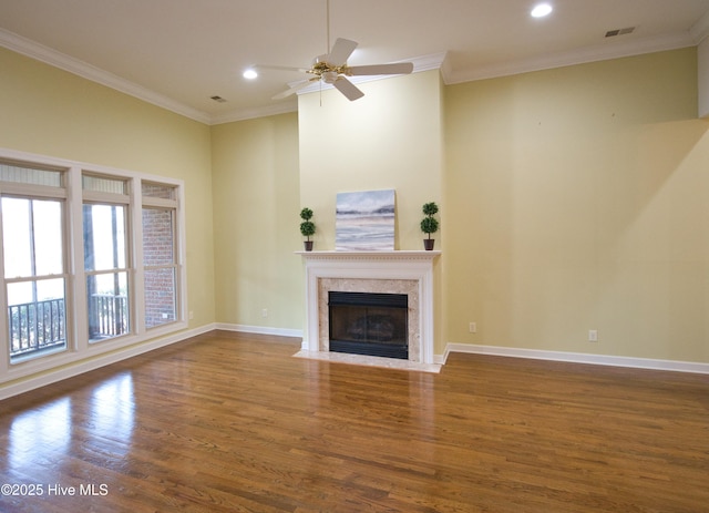 155 Abbington Pl SW, Ocean Isle Beach, NC 28469 - unfurnished living room with wood finished floors, recessed lighting, crown molding, a high end fireplace, and ceiling fan