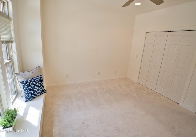 155 Abbington Pl SW, Ocean Isle Beach, NC 28469 - unfurnished bedroom with carpet, baseboards, ceiling fan, and a closet