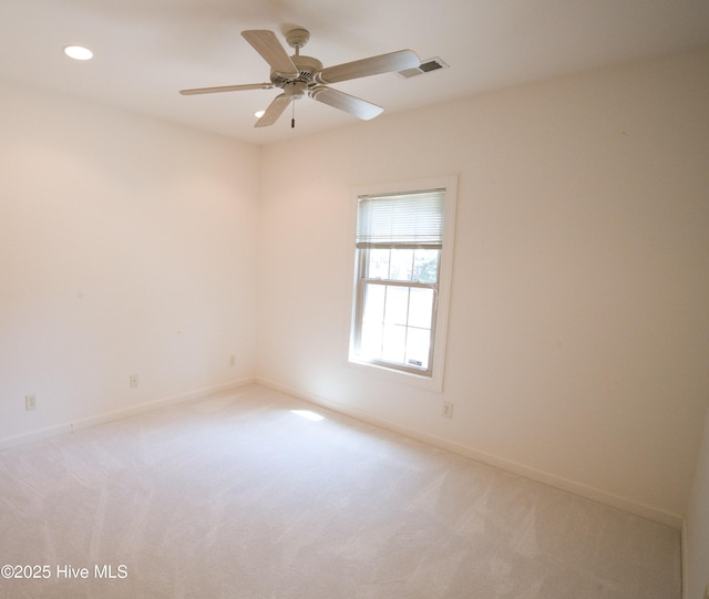 155 Abbington Pl SW, Ocean Isle Beach, NC 28469 - spare room featuring light carpet, recessed lighting, baseboards, and a ceiling fan