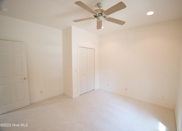 155 Abbington Pl SW, Ocean Isle Beach, NC 28469 - unfurnished bedroom with light colored carpet, recessed lighting, a closet, baseboards, and ceiling fan