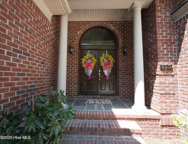 155 Abbington Pl SW, Ocean Isle Beach, NC 28469 - doorway to property with brick siding