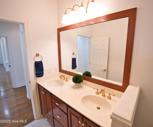 155 Abbington Pl SW, Ocean Isle Beach, NC 28469 - bathroom with double vanity and wood finished floors