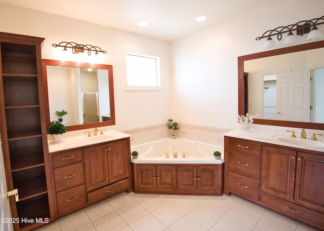 155 Abbington Pl SW, Ocean Isle Beach, NC 28469 - bathroom featuring two vanities, a garden tub, and tile patterned flooring