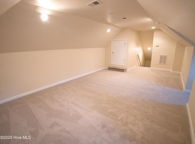 155 Abbington Pl SW, Ocean Isle Beach, NC 28469 - additional living space featuring light colored carpet, vaulted ceiling, and baseboards