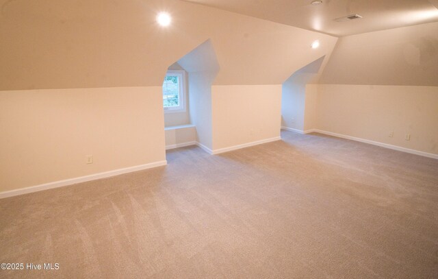 155 Abbington Pl SW, Ocean Isle Beach, NC 28469 - bonus room with carpet floors, vaulted ceiling, and baseboards