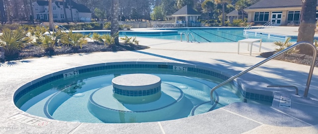 155 Abbington Pl SW, Ocean Isle Beach, NC 28469 - community pool featuring a community hot tub and a patio area