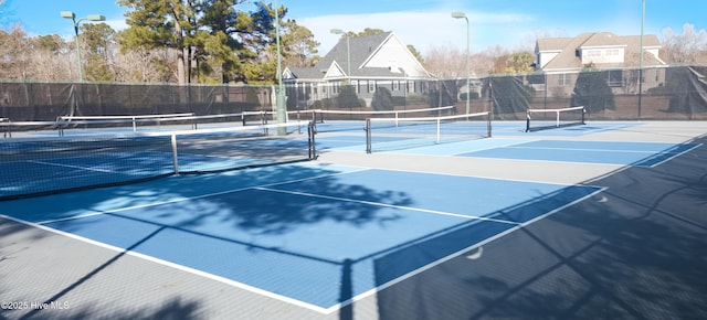 155 Abbington Pl SW, Ocean Isle Beach, NC 28469 - view of tennis court featuring fence