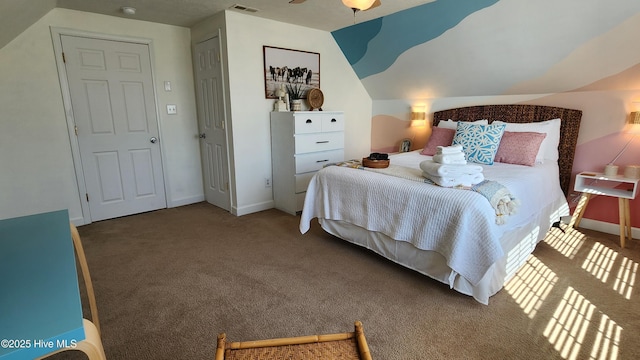 bedroom with carpet, visible vents, vaulted ceiling, and baseboards