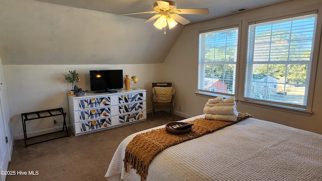 bedroom featuring baseboards, visible vents, ceiling fan, vaulted ceiling, and dark carpet