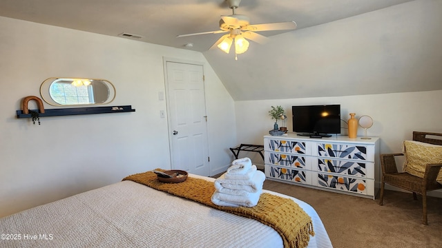 carpeted bedroom with lofted ceiling, ceiling fan, and visible vents