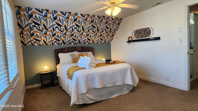 bedroom with carpet floors, a ceiling fan, visible vents, baseboards, and wallpapered walls