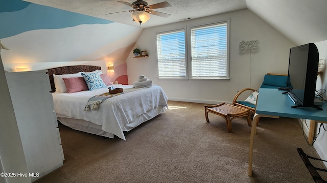 bedroom with dark colored carpet, a ceiling fan, vaulted ceiling, a textured ceiling, and baseboards