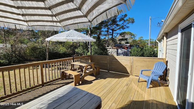 wooden deck featuring fence