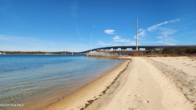 property view of water featuring a beach view