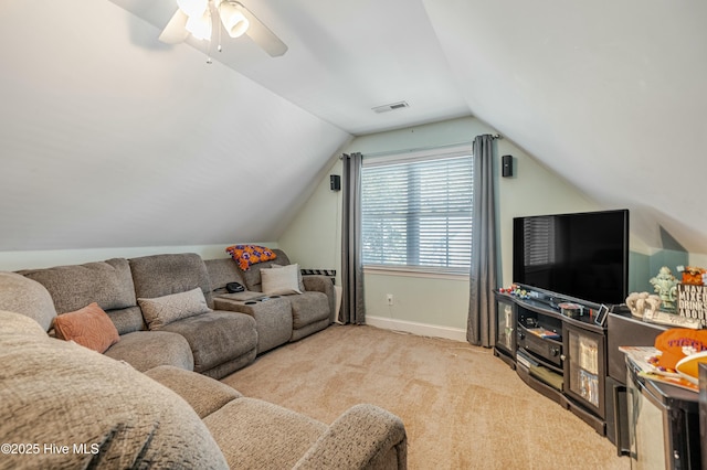 living area featuring baseboards, visible vents, light colored carpet, lofted ceiling, and ceiling fan