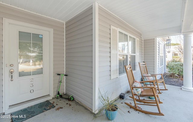 entrance to property with a porch