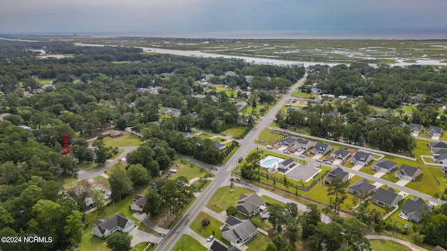 drone / aerial view featuring a water view and a residential view