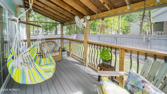 deck with a fenced backyard