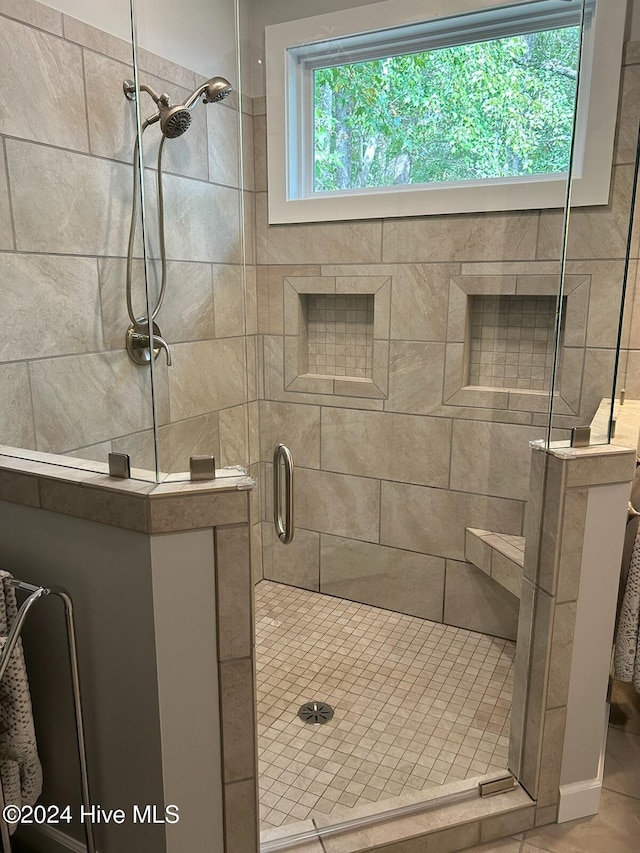 bathroom featuring a shower stall