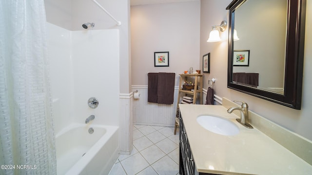 bathroom with tile patterned floors, vanity, shower / bath combination with curtain, and wainscoting