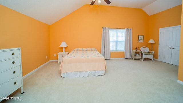 bedroom with light colored carpet, vaulted ceiling, baseboards, and ceiling fan