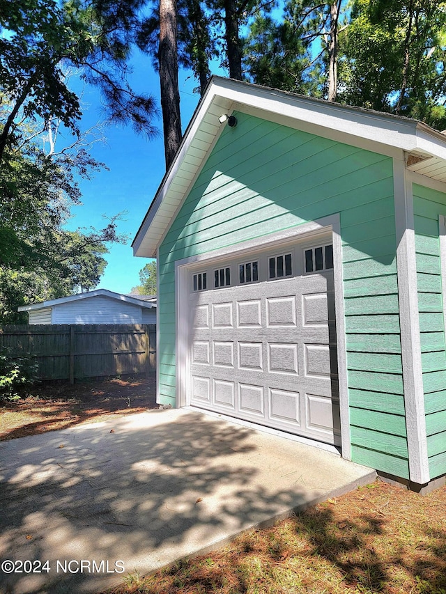 garage featuring fence