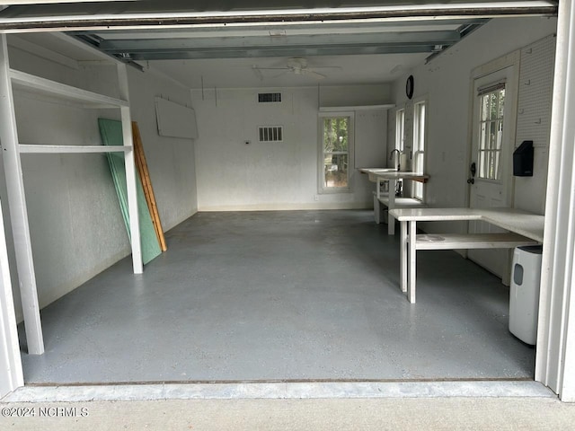 garage with visible vents and a ceiling fan