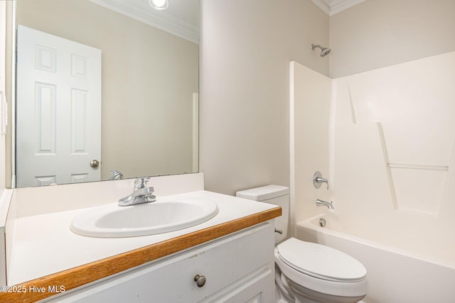 bathroom featuring toilet, vanity, bathing tub / shower combination, and crown molding