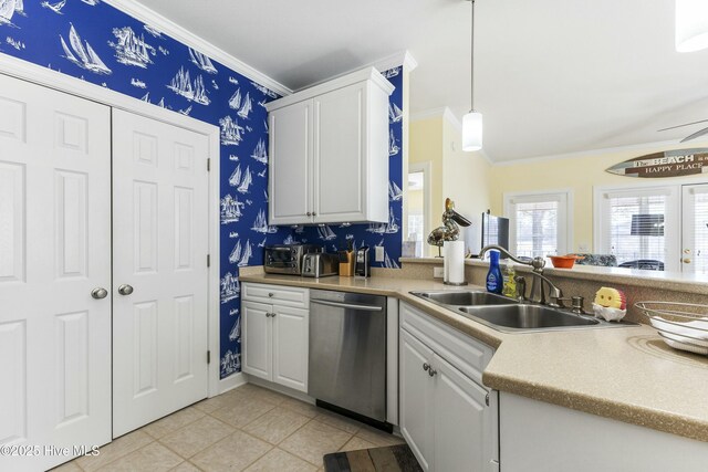 kitchen with a sink, wallpapered walls, crown molding, and dishwasher