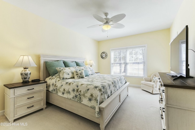 bedroom with light carpet, a ceiling fan, and baseboards