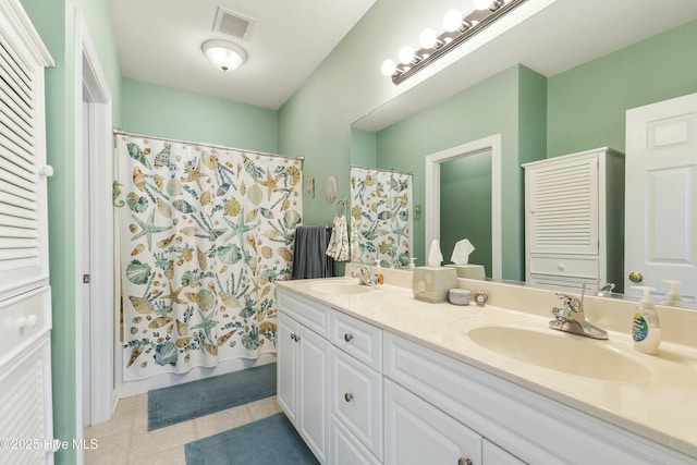 full bathroom featuring tile patterned floors, visible vents, a sink, and double vanity