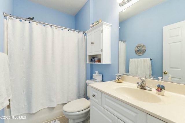 full bathroom with toilet, shower / tub combo, and vanity