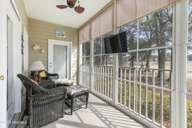 sunroom with a ceiling fan