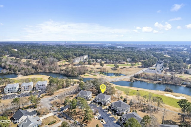 drone / aerial view featuring a water view and golf course view