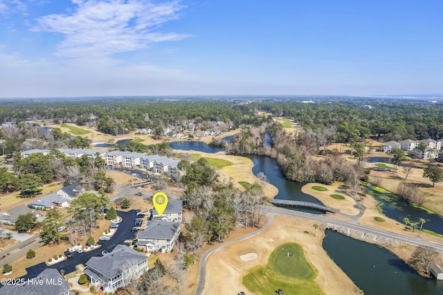 aerial view with a residential view, view of golf course, and a water view