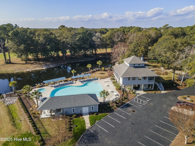 birds eye view of property with a water view