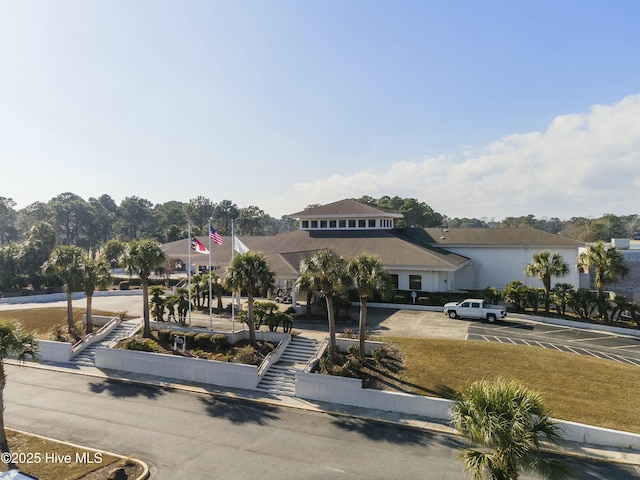 view of front of house with uncovered parking