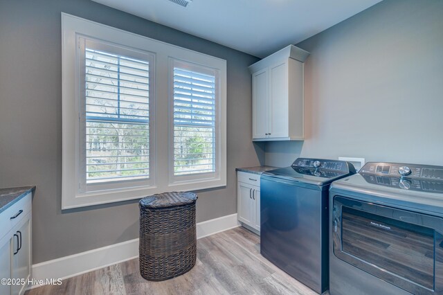 bathroom featuring toilet, wood finished floors, vanity, baseboards, and crown molding