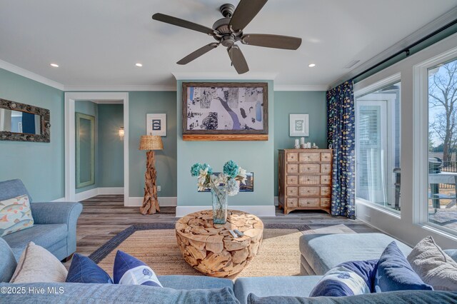 living room with recessed lighting, light wood-type flooring, and baseboards